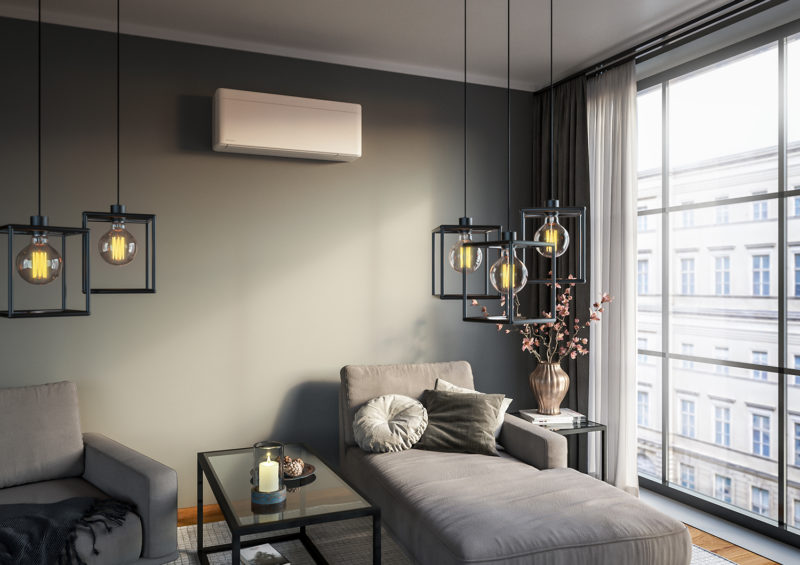 a living room with a couch and a air conditioner