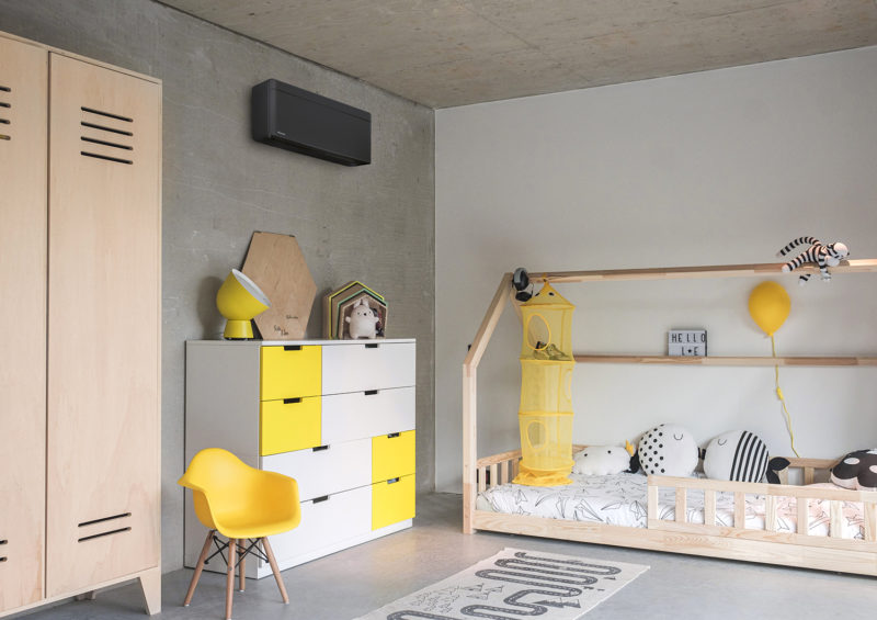 a room with a bed and a dresser
